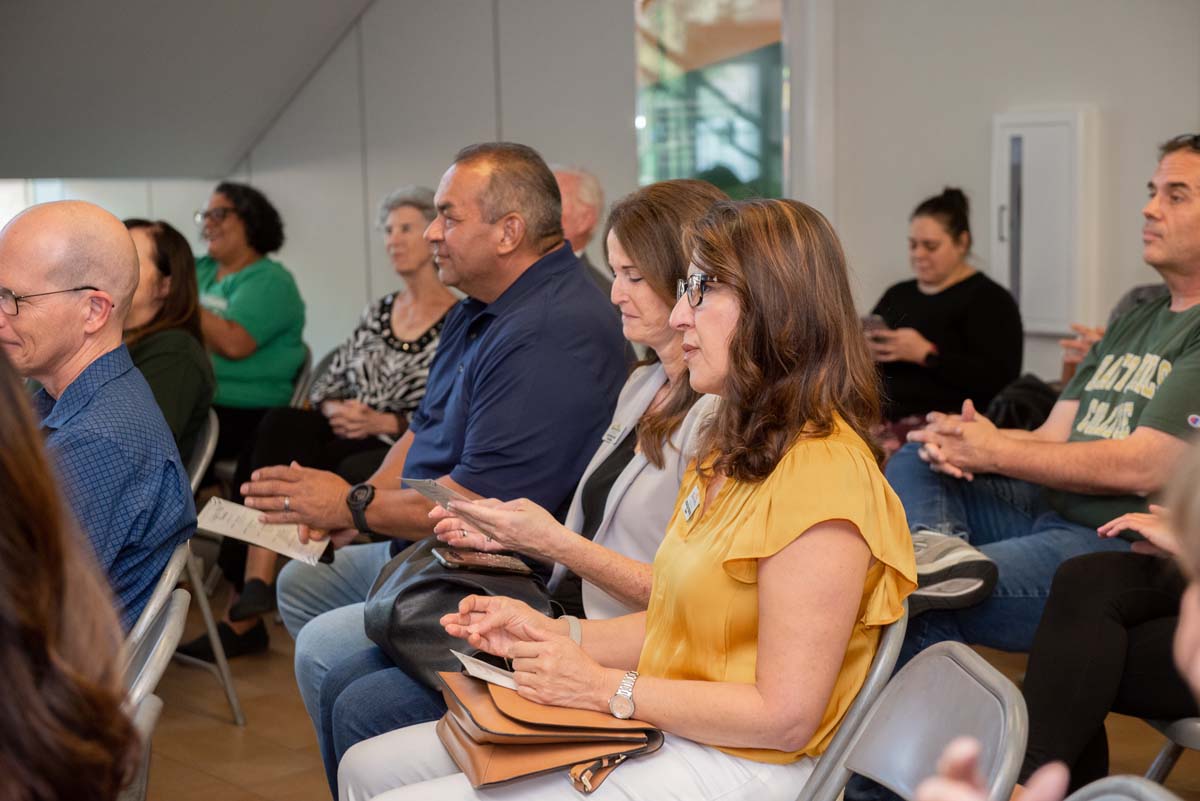 People enjoying the Legacy Wall unveiling