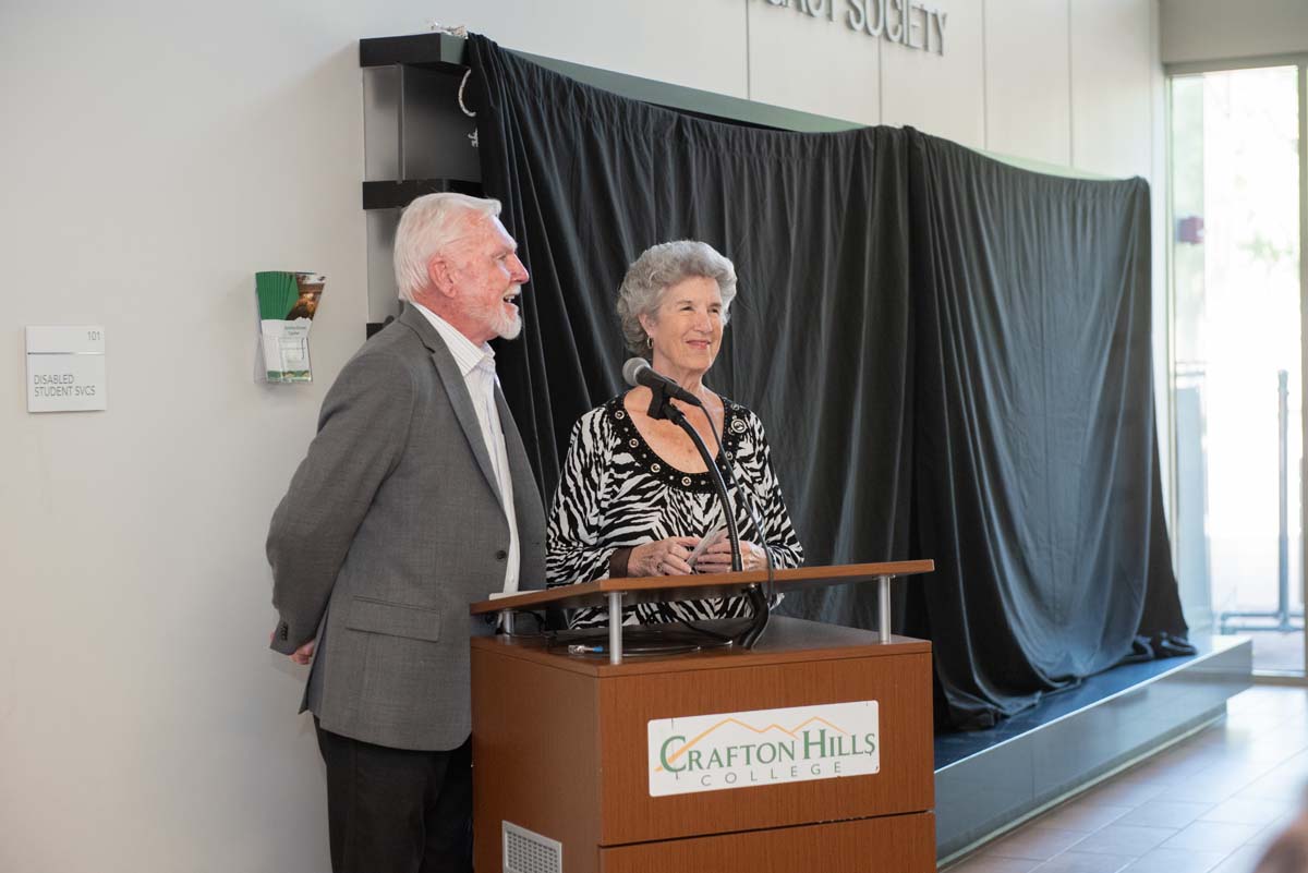 People enjoying the Legacy Wall unveiling