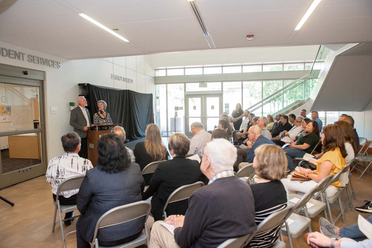 People enjoying the Legacy Wall unveiling