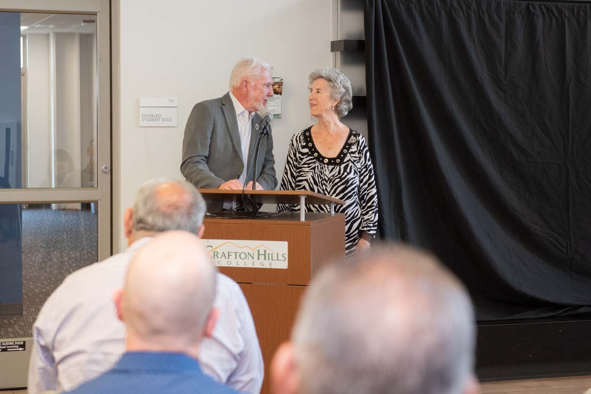 People enjoying the Legacy Wall unveiling