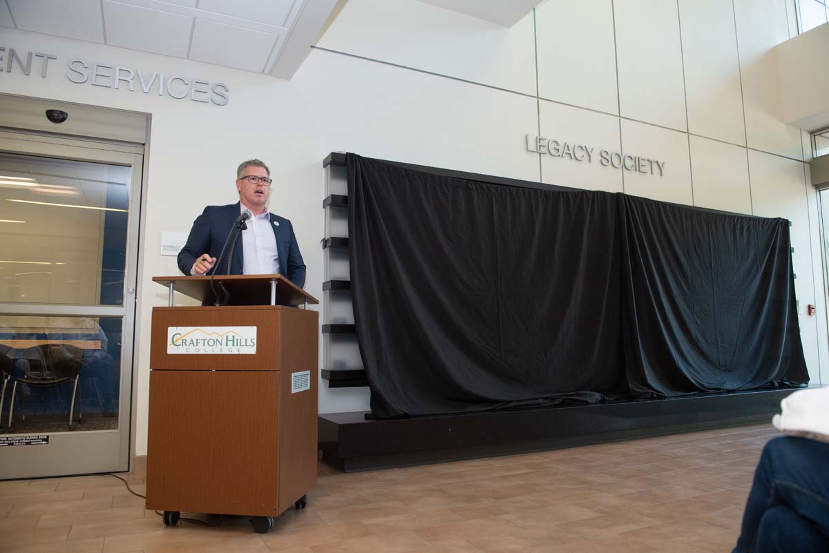 People enjoying the Legacy Wall unveiling