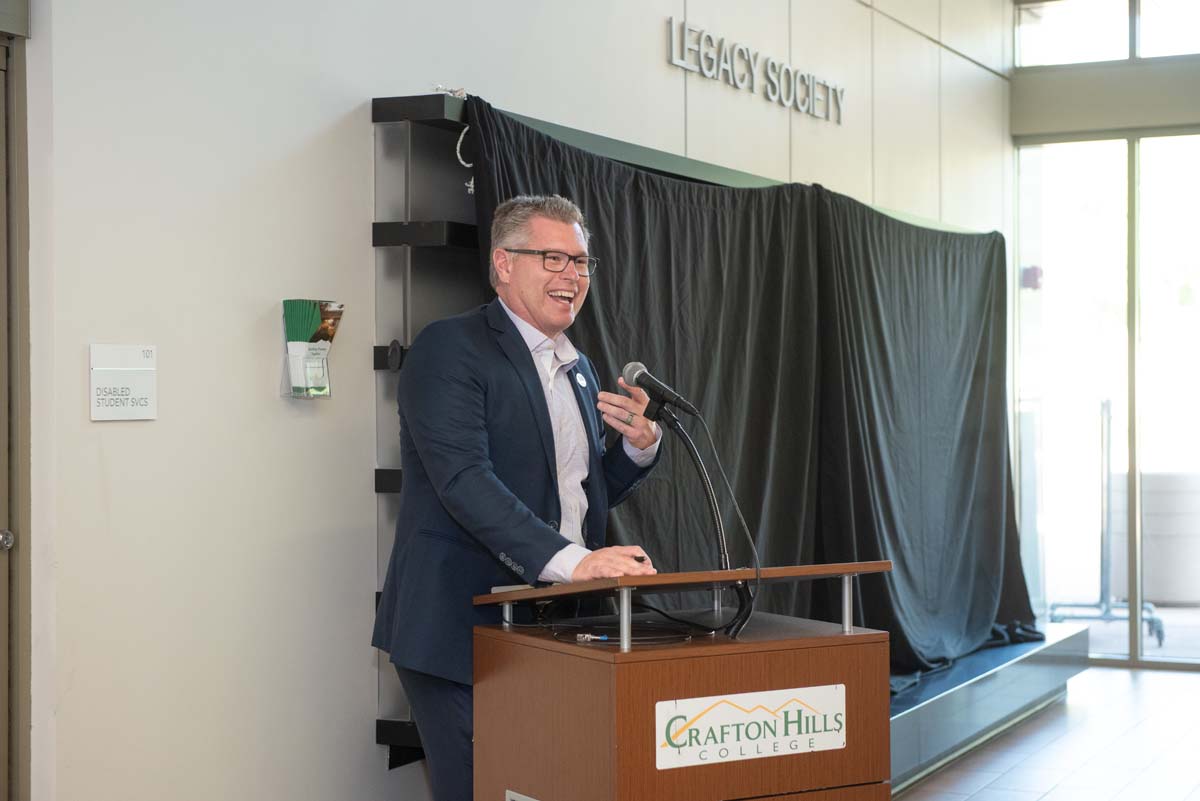 People enjoying the Legacy Wall unveiling