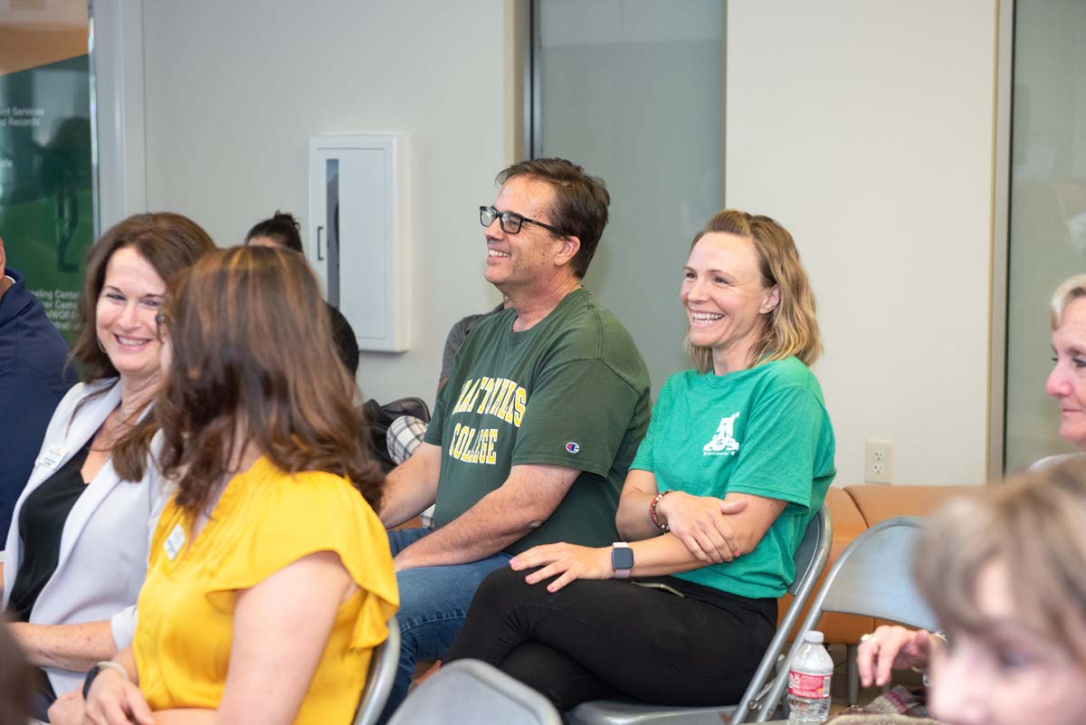 People enjoying the Legacy Wall unveiling