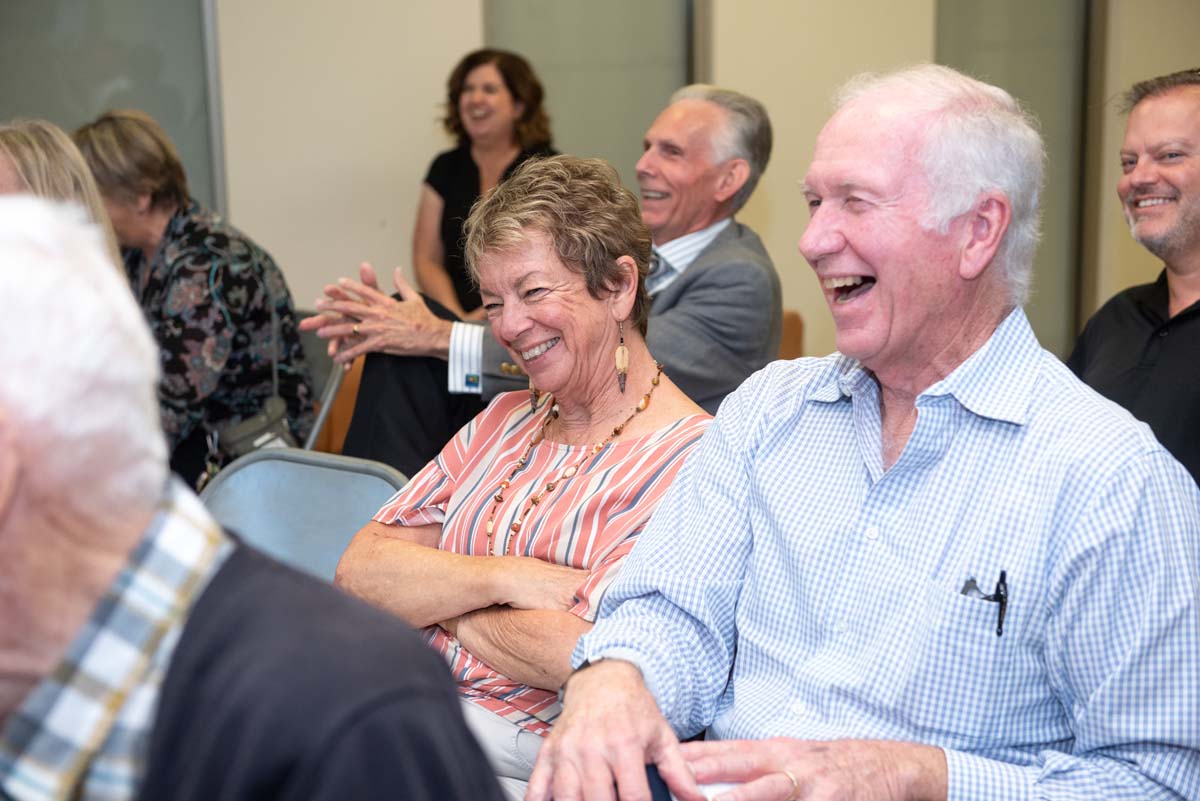 People enjoying the Legacy Wall unveiling