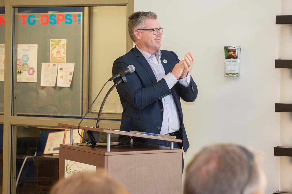 People enjoying the Legacy Wall unveiling