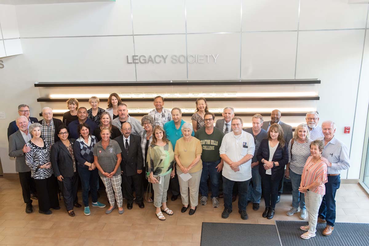 People enjoying the Legacy Wall unveiling