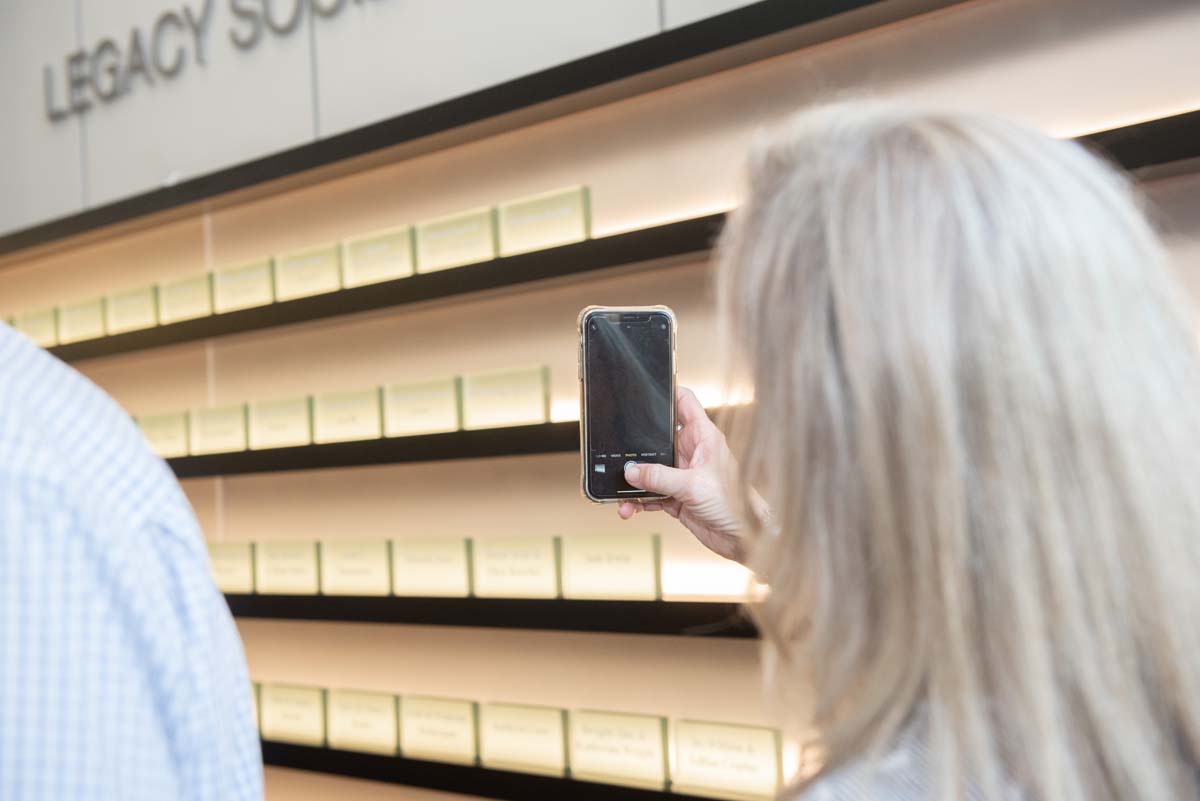People enjoying the Legacy Wall unveiling