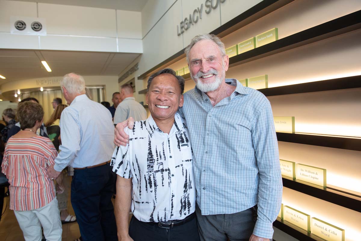People enjoying the Legacy Wall unveiling
