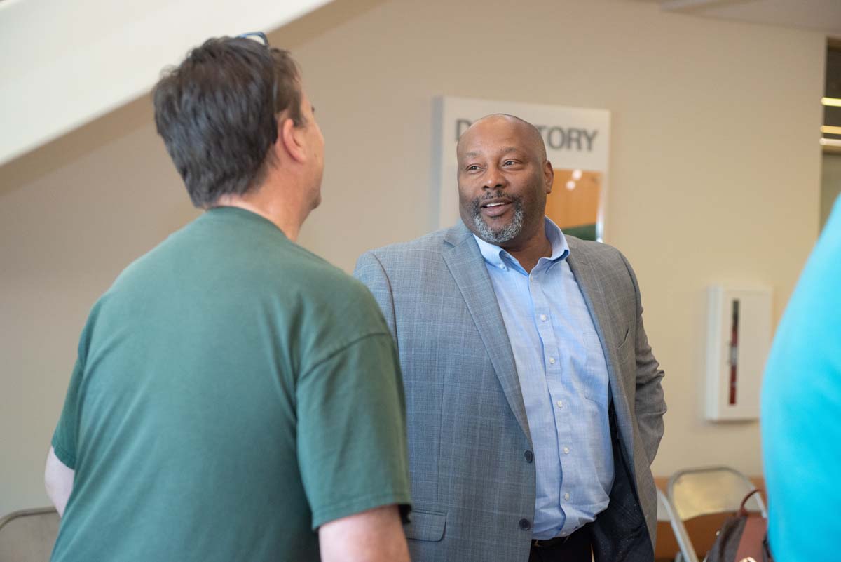 People enjoying the Legacy Wall unveiling