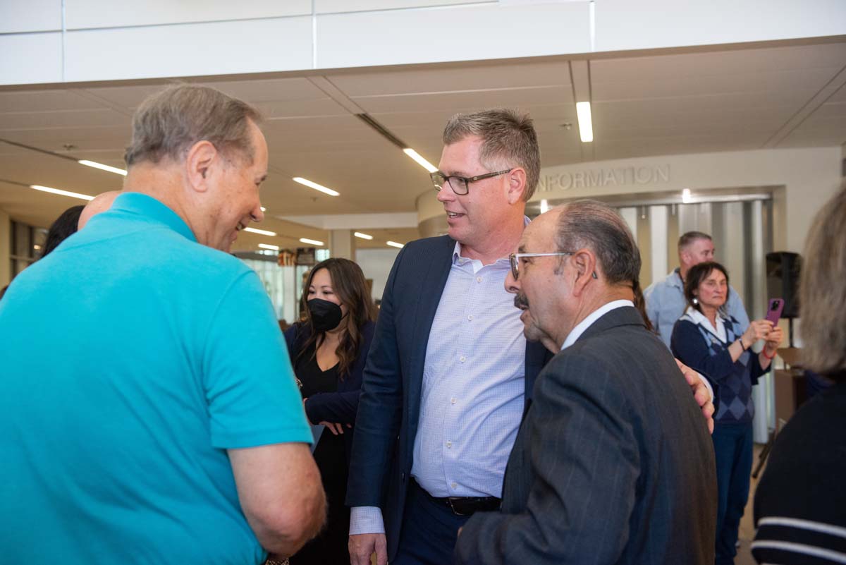 People enjoying the Legacy Wall unveiling