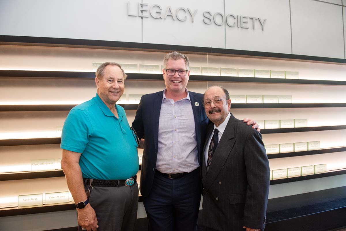 People enjoying the Legacy Wall unveiling