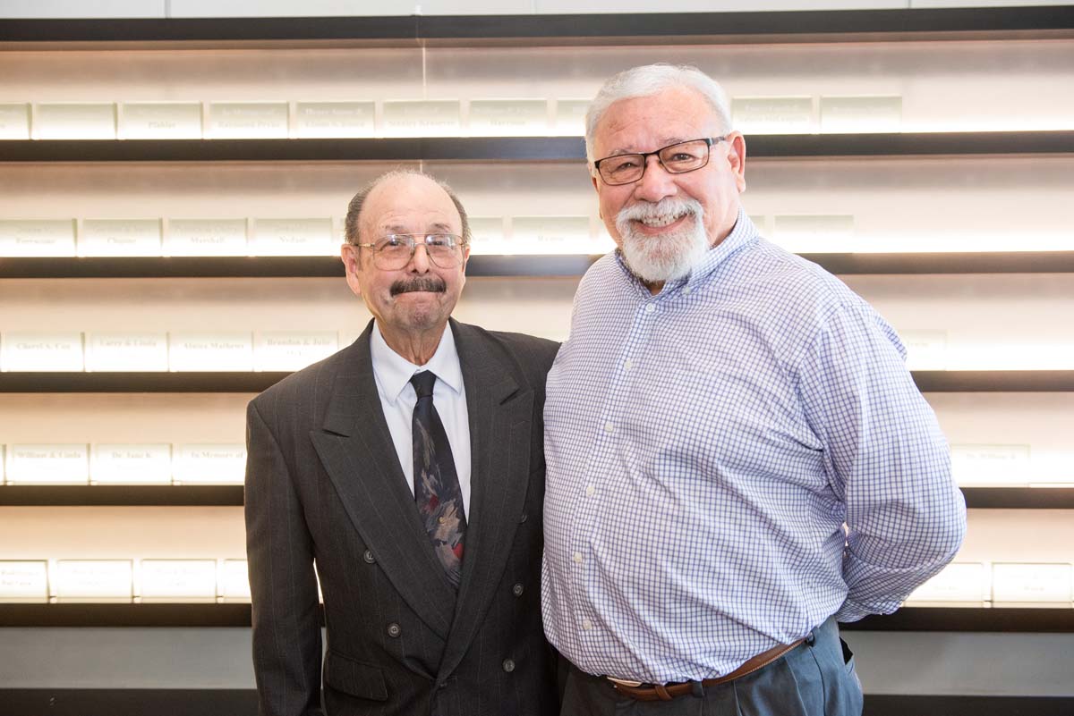 People enjoying the Legacy Wall unveiling