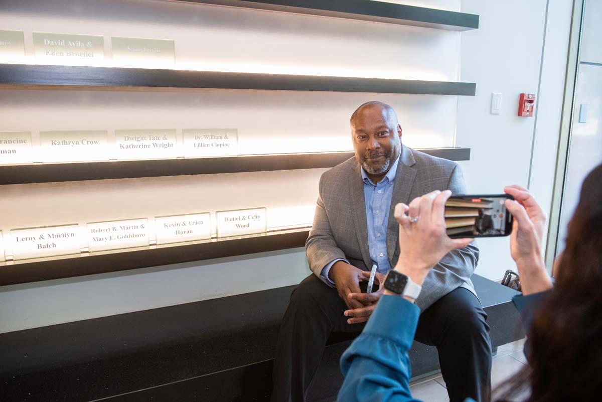 People enjoying the Legacy Wall unveiling