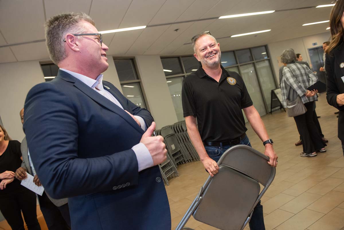 People enjoying the Legacy Wall unveiling