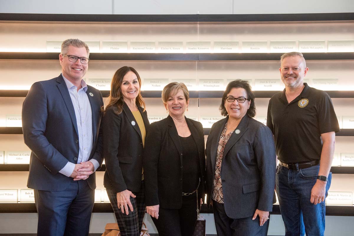 People enjoying the Legacy Wall unveiling