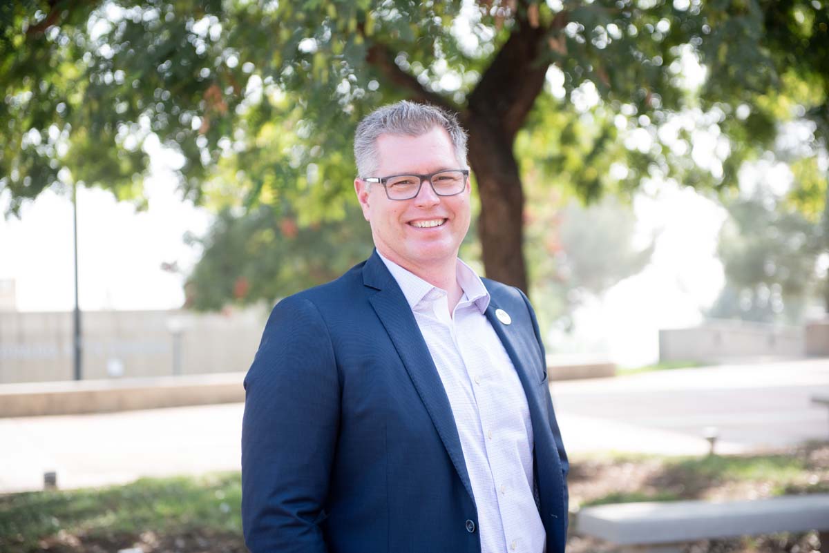 People enjoying the Legacy Wall unveiling