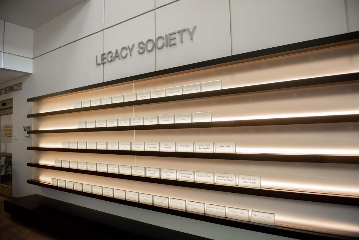 People enjoying the Legacy Wall unveiling