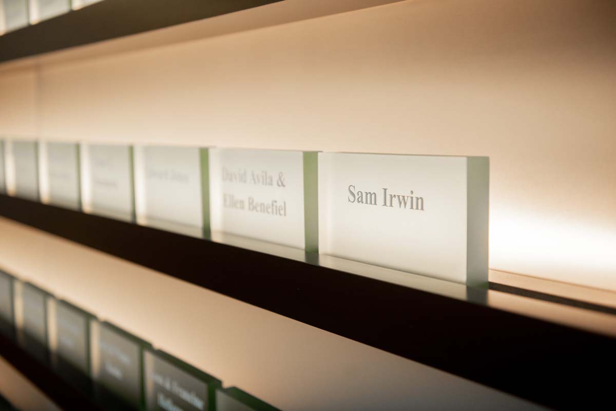 People enjoying the Legacy Wall unveiling