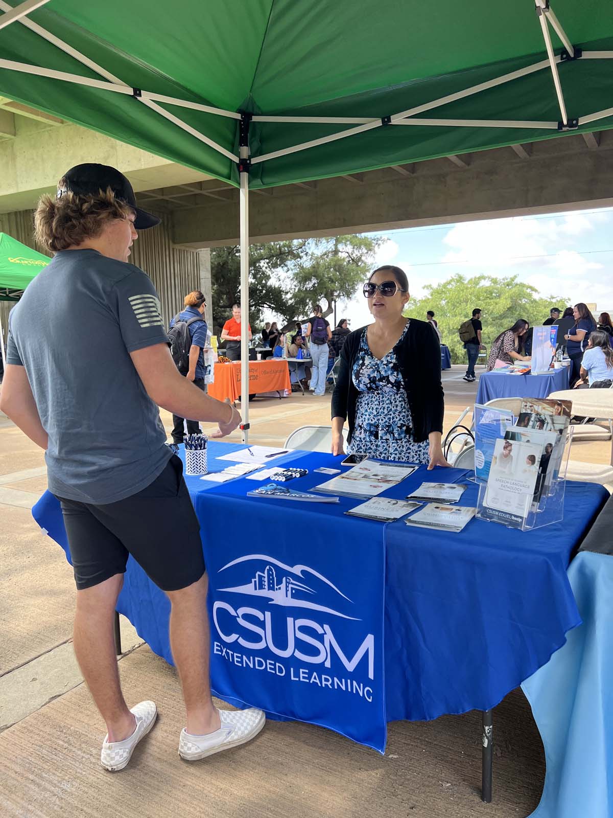 People enjoying the Transfer Fair and Hispanic Heritage Kickoff Event