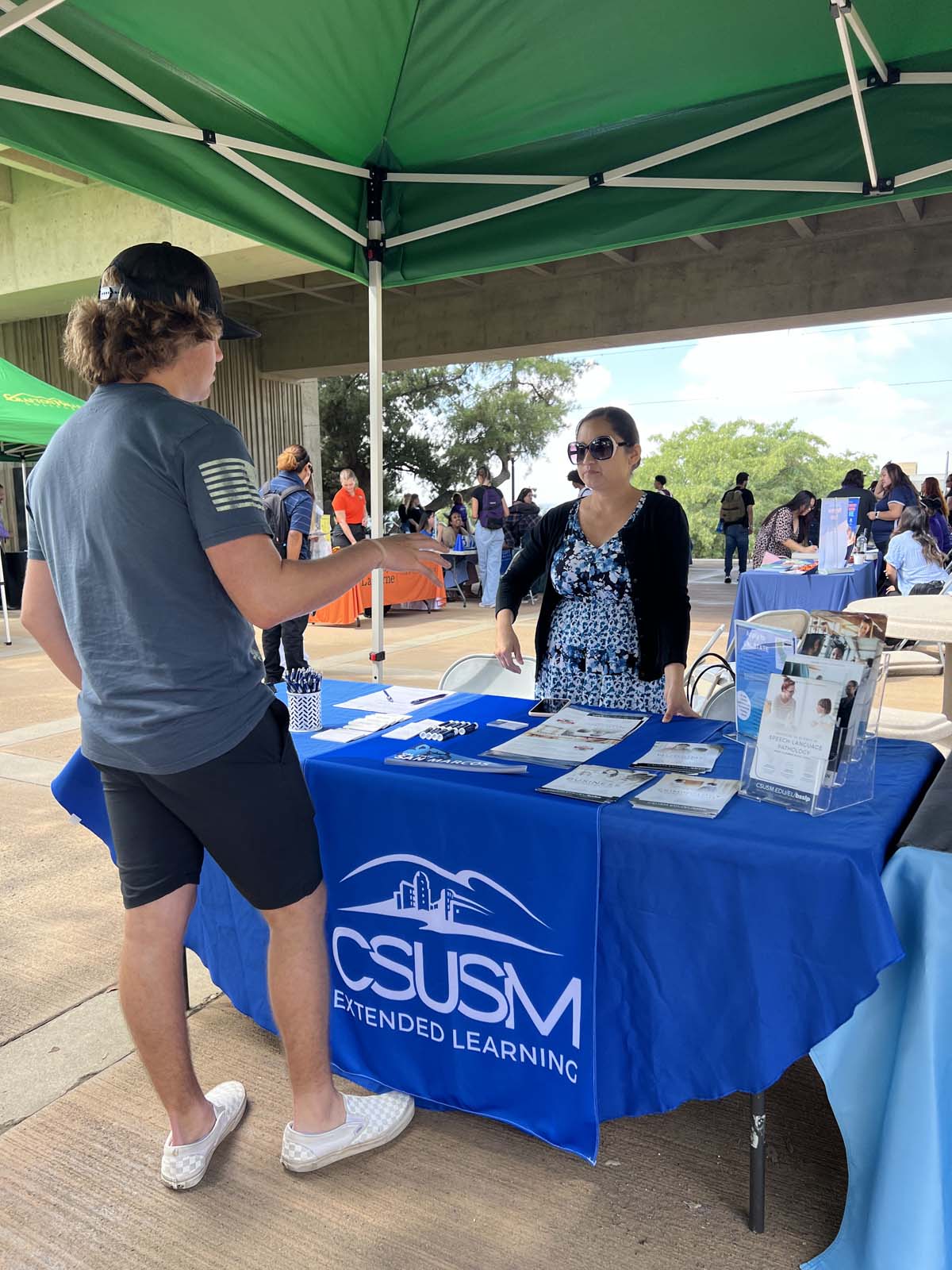 People enjoying the Transfer Fair and Hispanic Heritage Kickoff Event