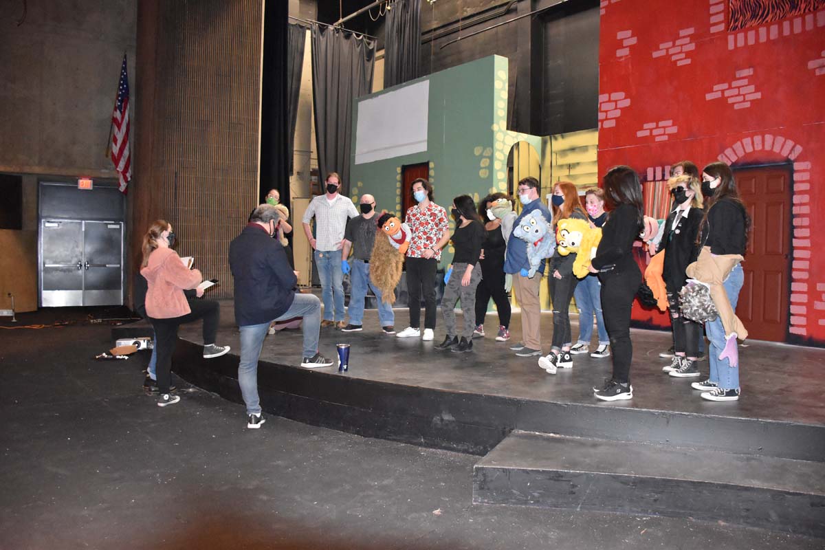 Performers at an Avenue Q rehearsal