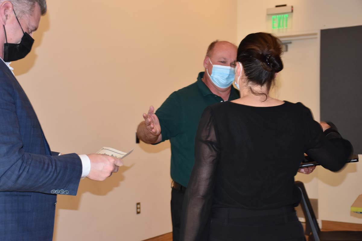 People enjoying the tenure celebration.