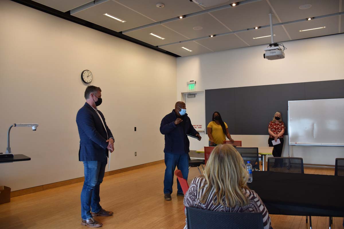 People enjoying the tenure celebration.