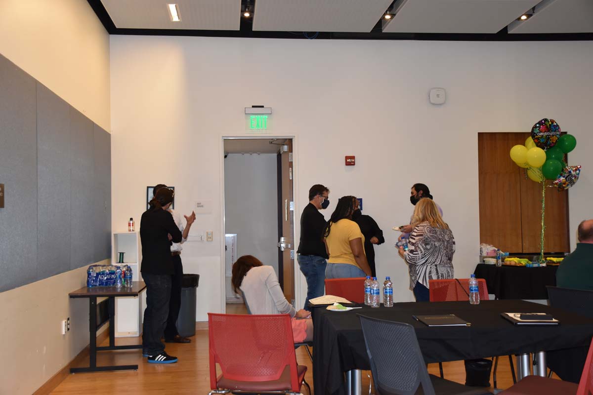 People enjoying the tenure celebration.