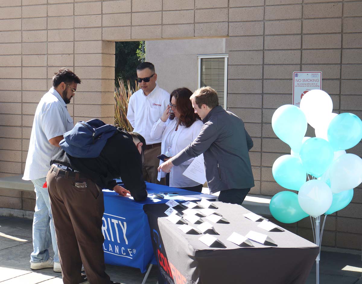 People enjoying the Confire Pioneering Partnership for EMT Training and Employment event.