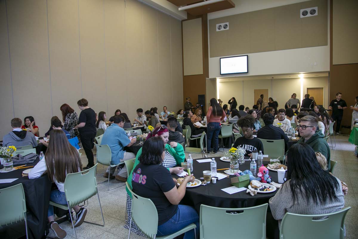 Students celebrate making deans list at event.