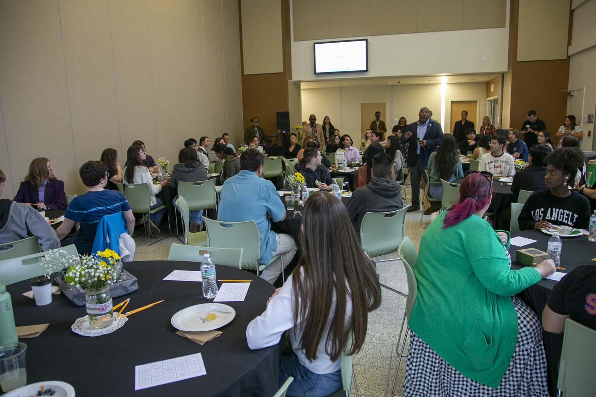 Students celebrate making deans list at event.