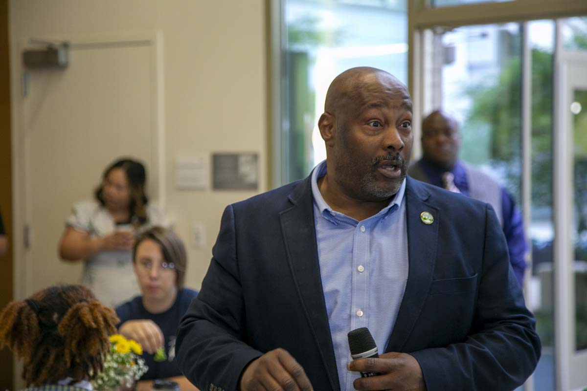 Students celebrate making deans list at event.