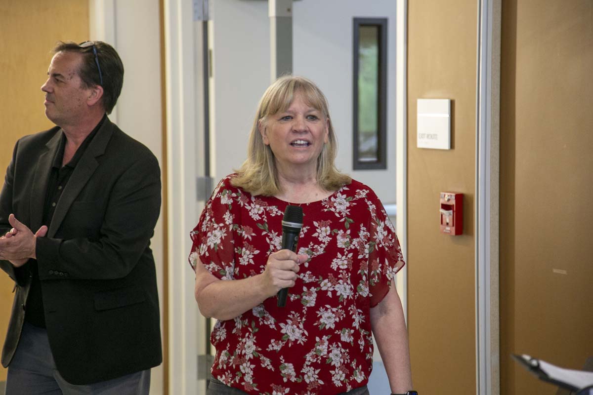 Students celebrate making deans list at event.