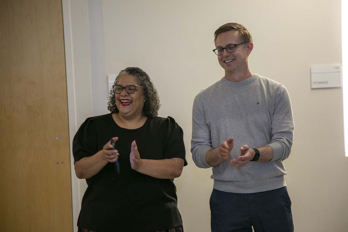 Students celebrate making deans list at event.