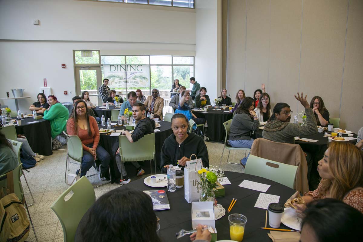 Students celebrate making deans list at event.