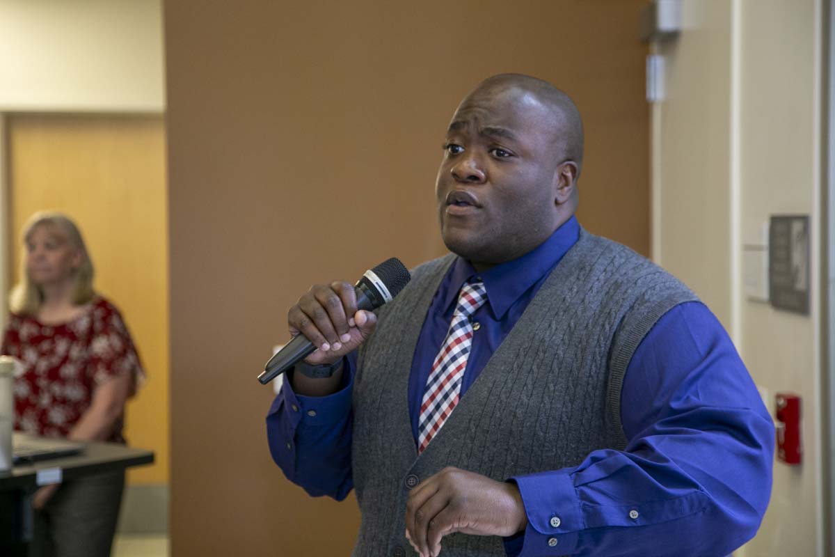 Students celebrate making deans list at event.