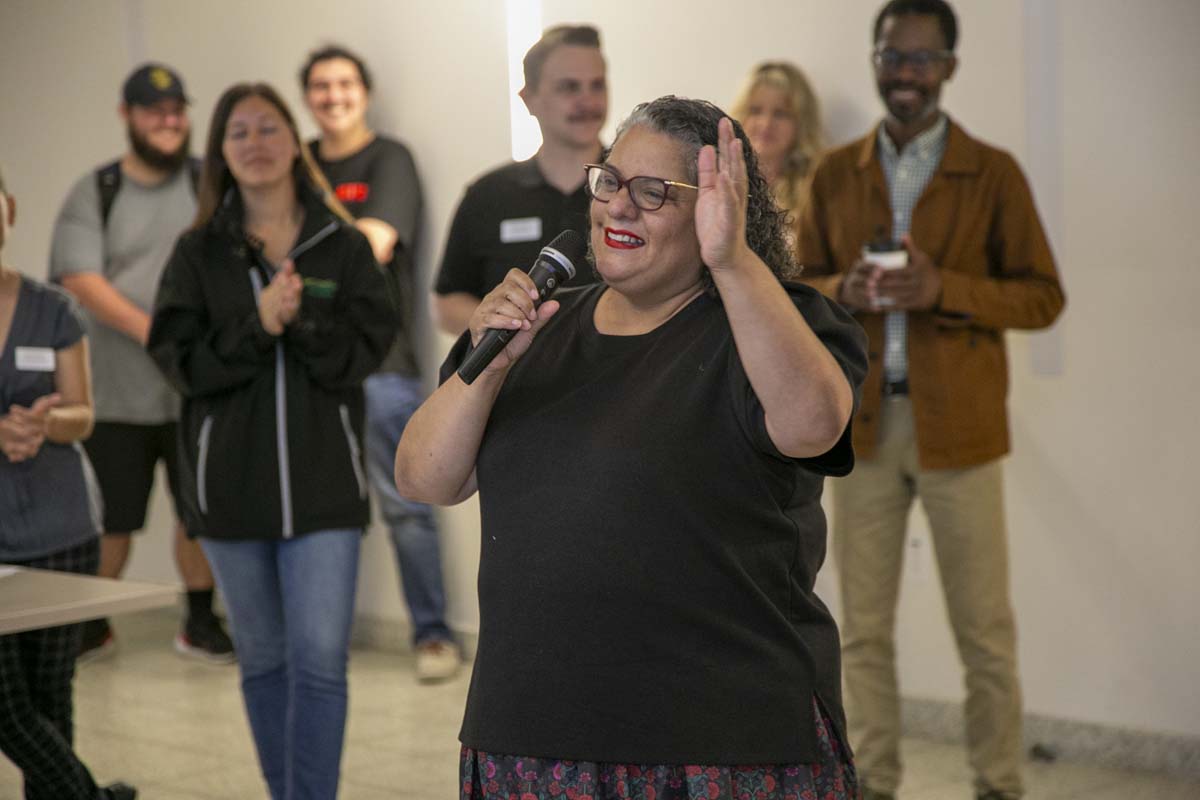 Students celebrate making deans list at event.