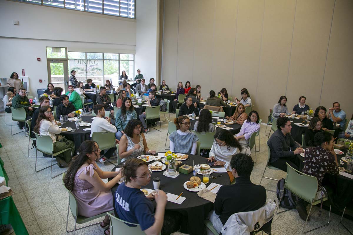Students celebrate making deans list at event.