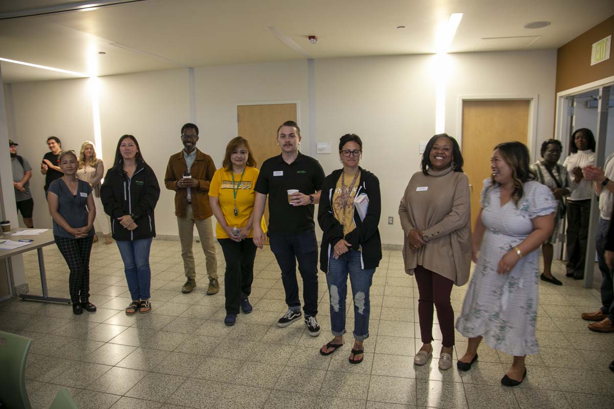 Students celebrate making deans list at event.