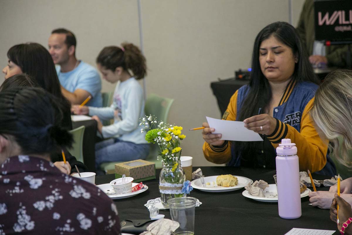 Students celebrate making deans list at event.