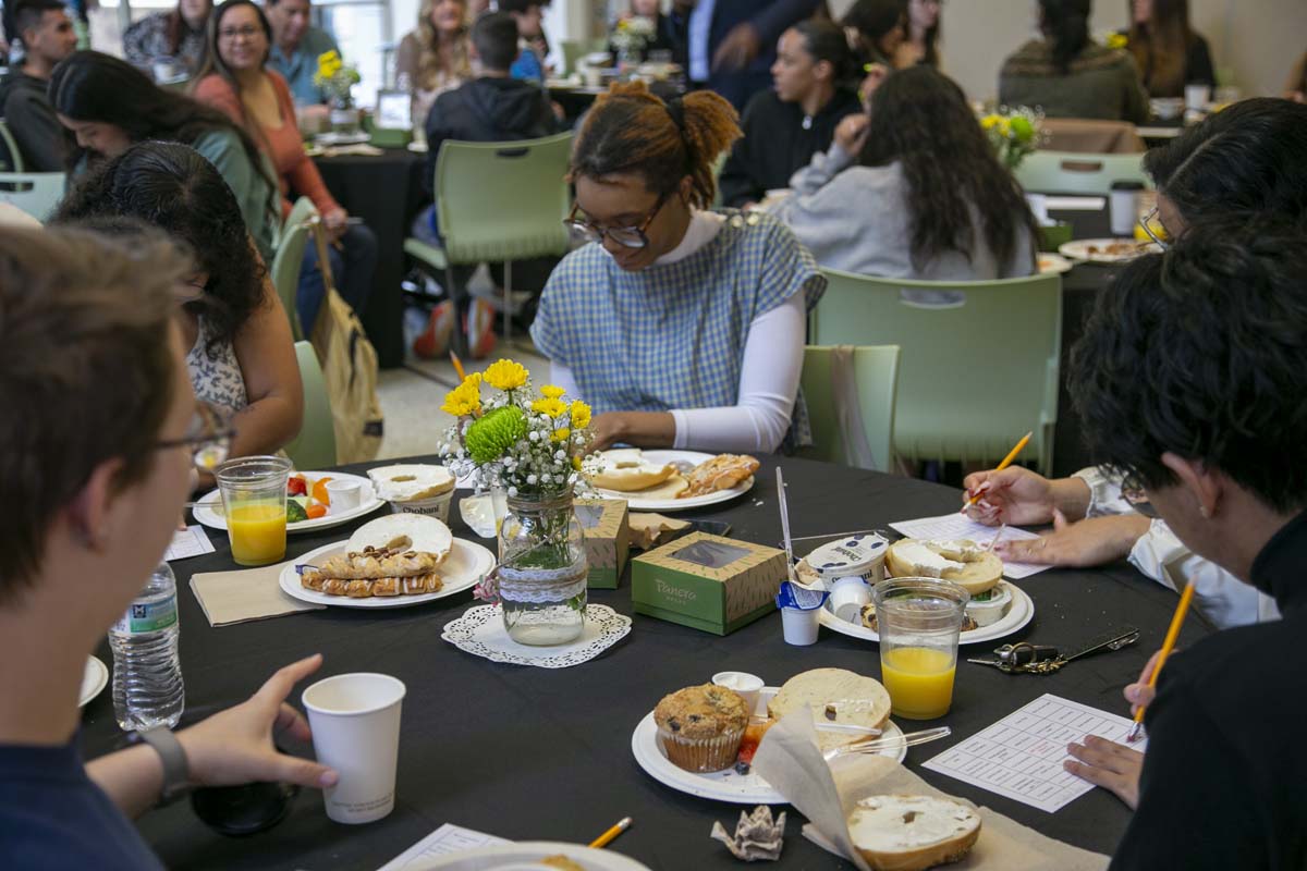 Students celebrate making deans list at event.