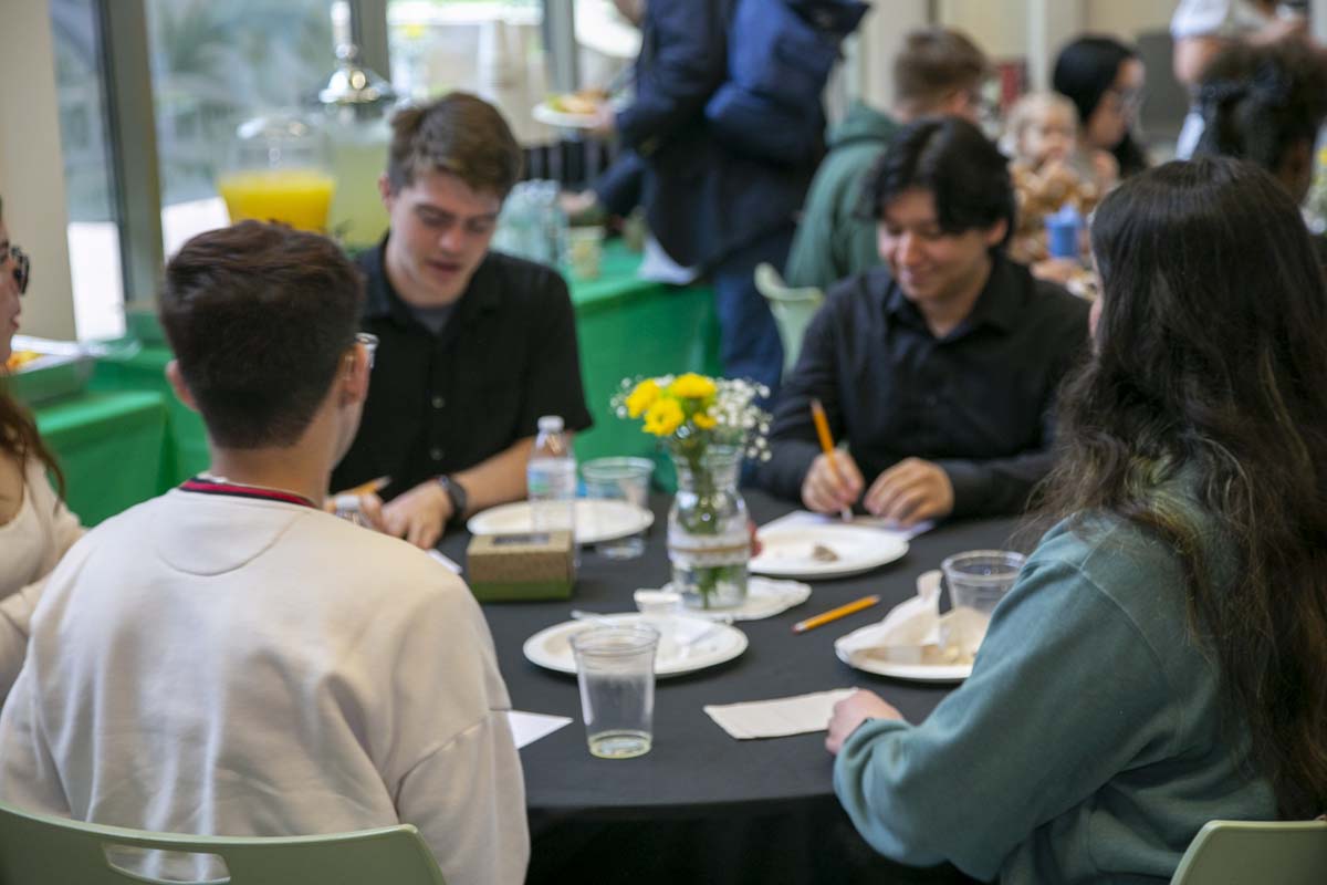 Students celebrate making deans list at event.