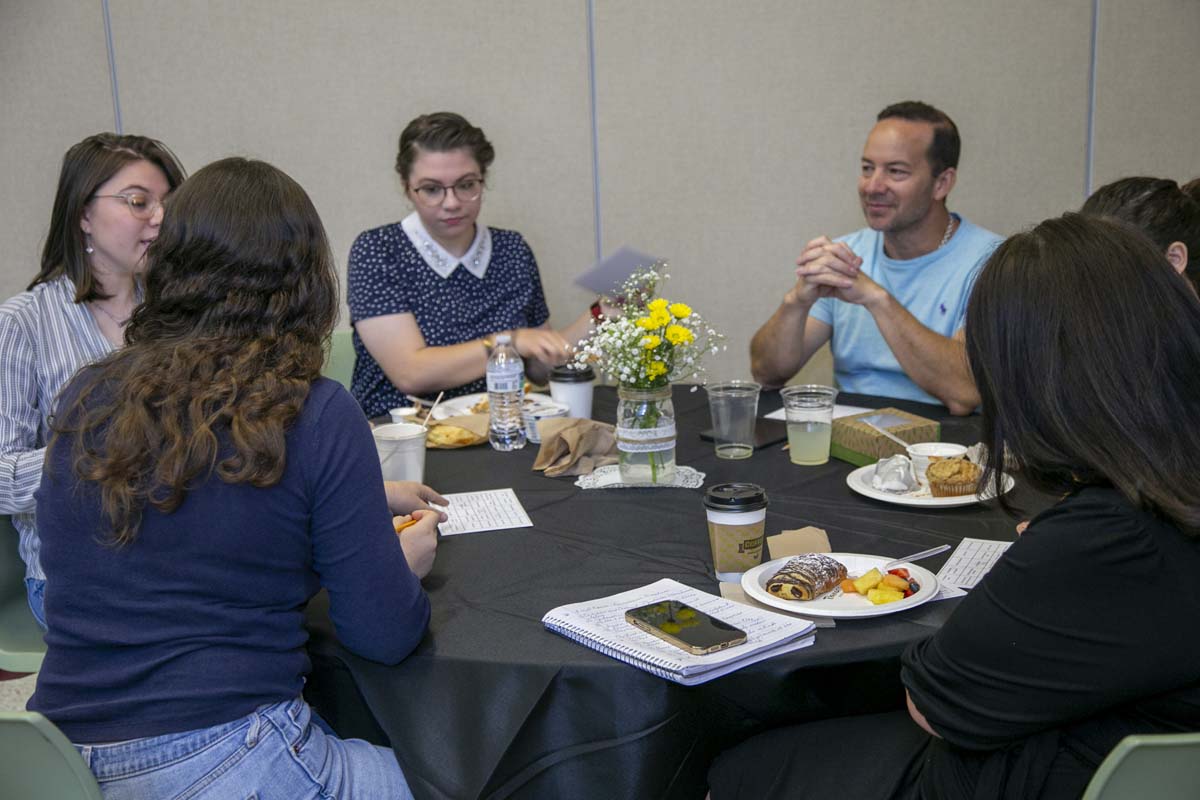 Students celebrate making deans list at event.