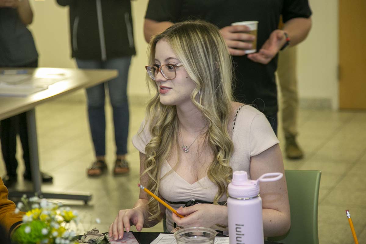 Students celebrate making deans list at event.