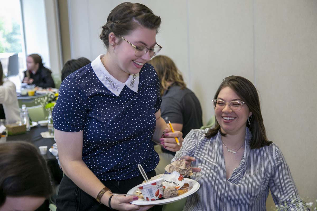 Students celebrate making deans list at event.