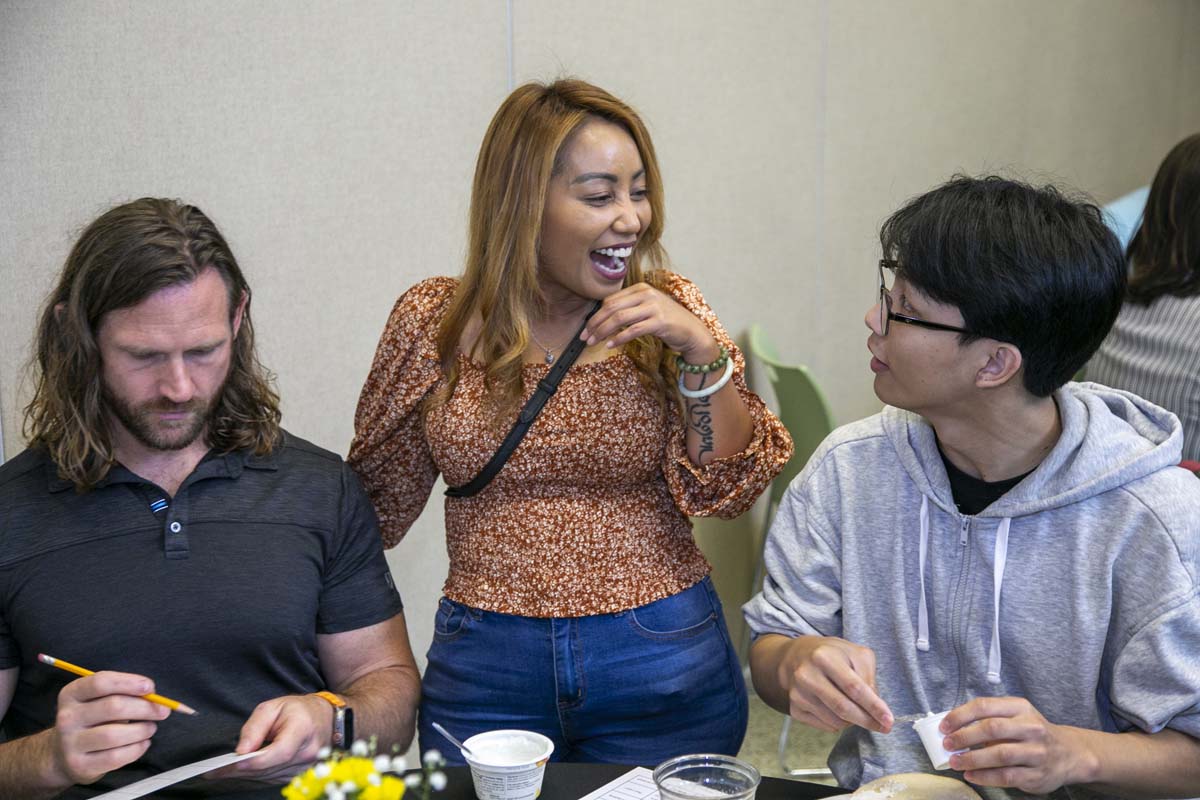 Students celebrate making deans list at event.