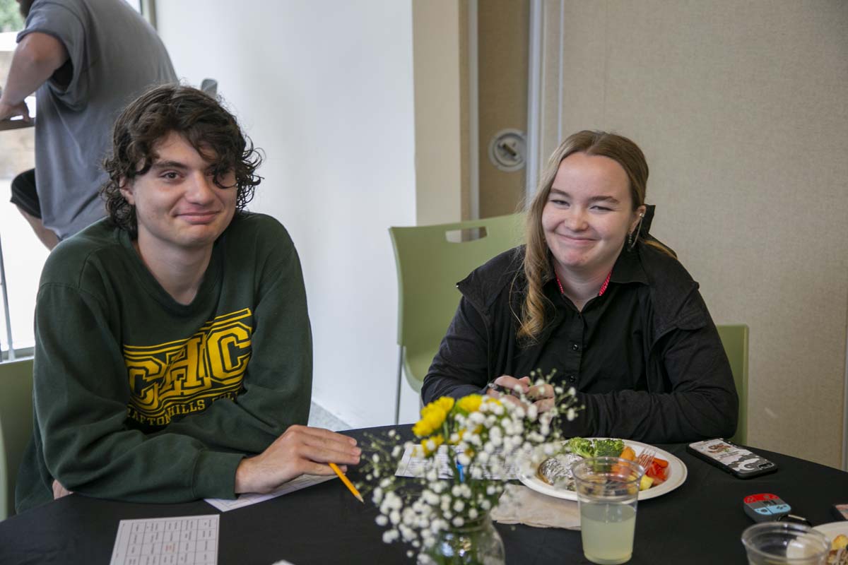 Students celebrate making deans list at event.