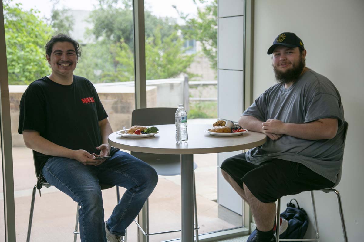 Students celebrate making deans list at event.