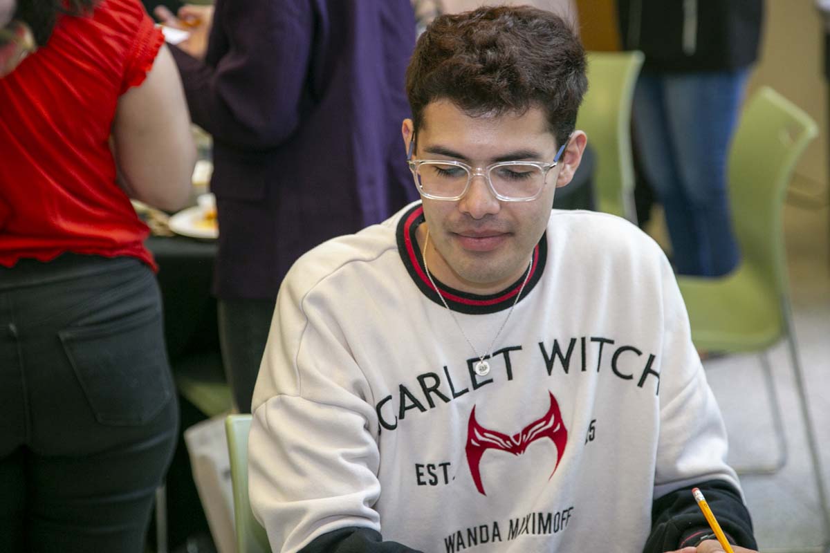 Students celebrate making deans list at event.