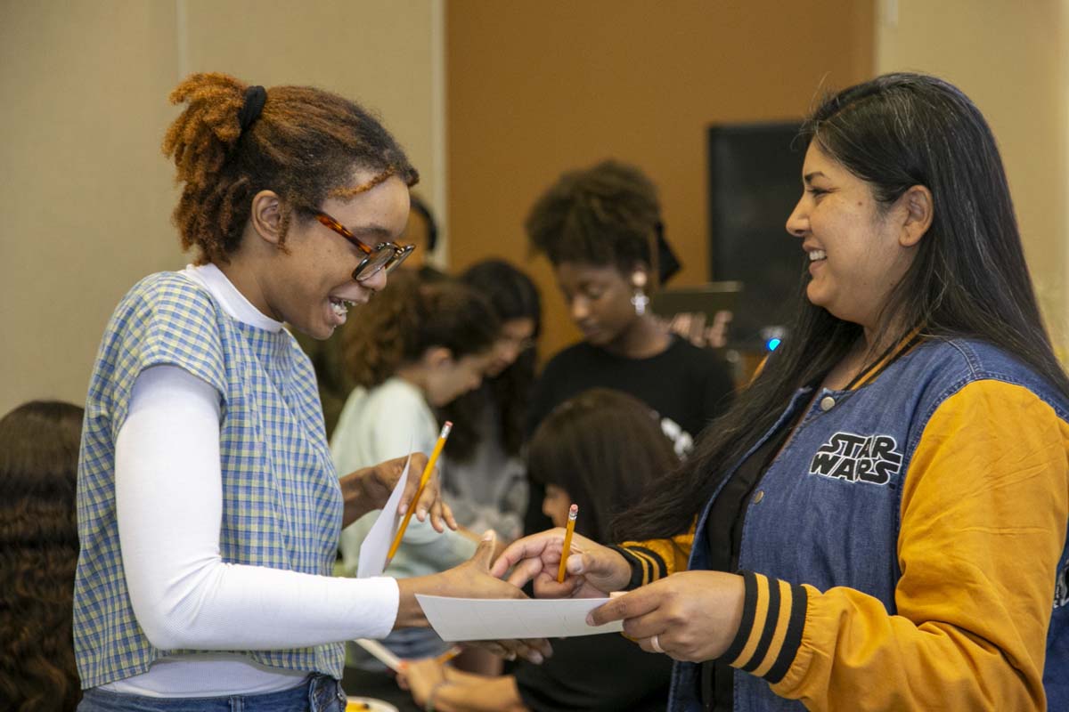 Students celebrate making deans list at event.